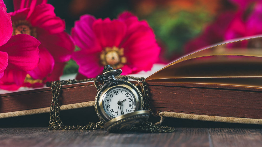 A clock surrounded by flowers, representing the extended biological timeline of ovarian aging before menopause