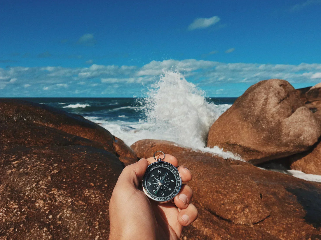 A compass over the sea, symbolizing guidance and direction through the menopause journey