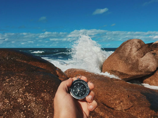 A compass over the sea, symbolizing guidance and direction through the menopause journey
