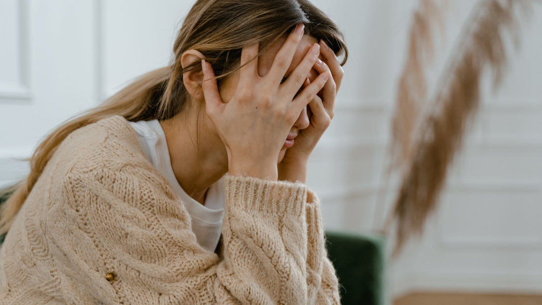 Woman looking thoughtfully at hormone test results, representing the challenges of perimenopause testing